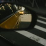 car on rear view mirror